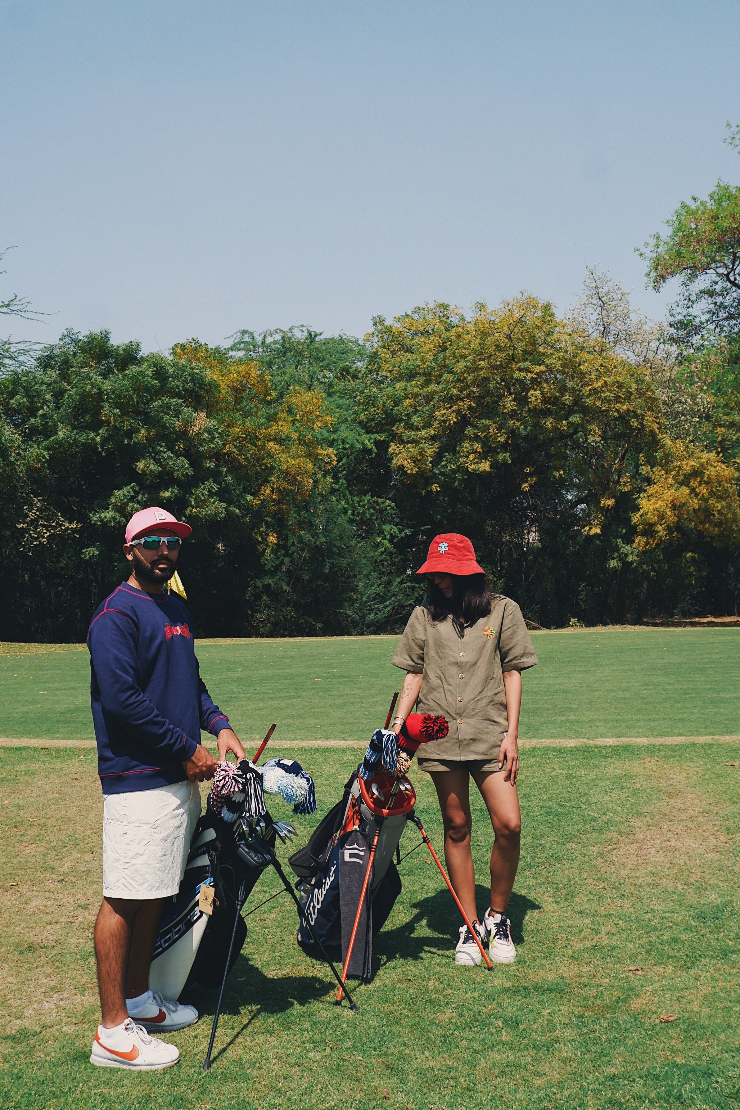 an image of two people ready for a game of golf on a golf course