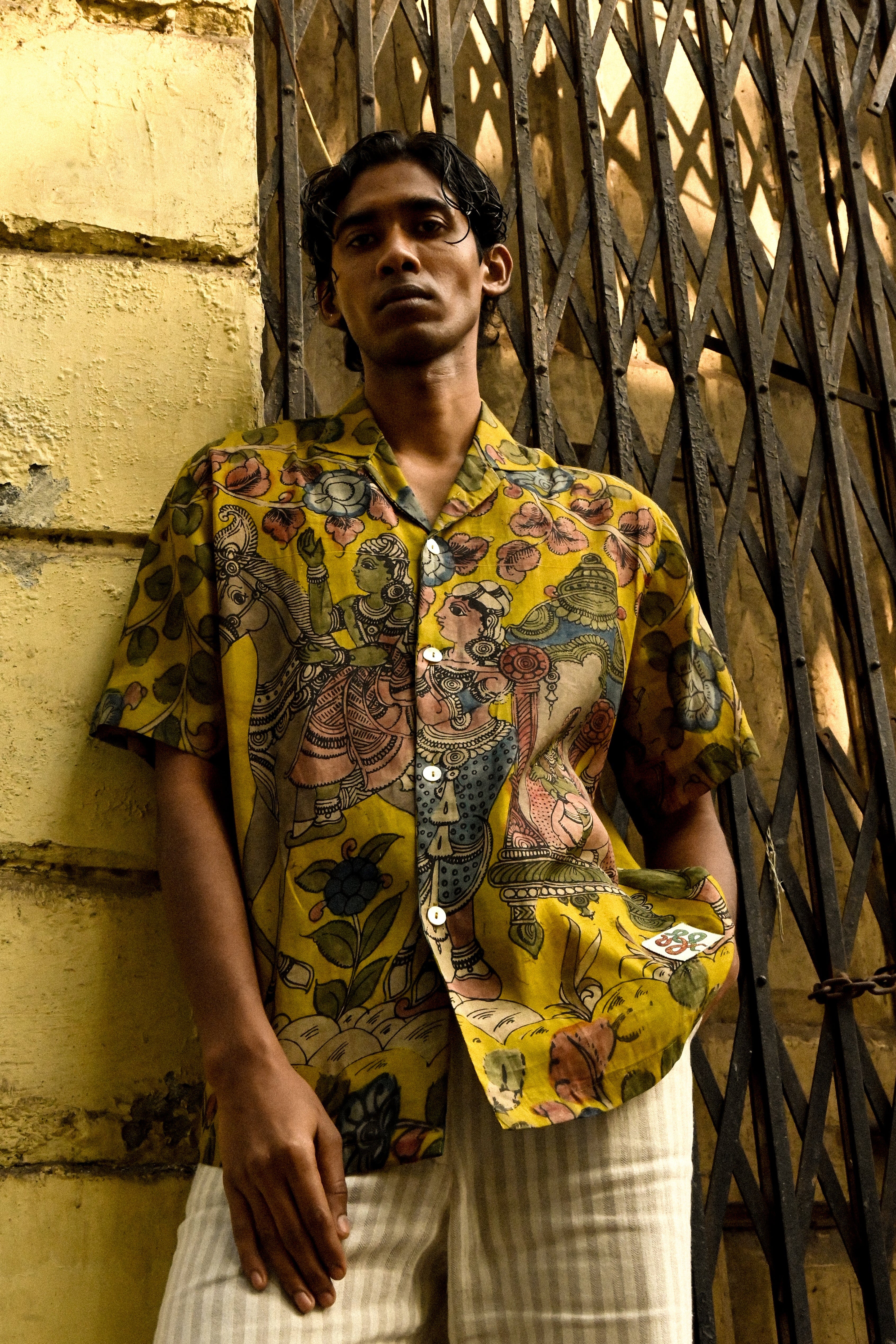 Temple Bells Kalamkari Shirt – Hand-painted cotton silk with a Cuban collar & pearl buttons.